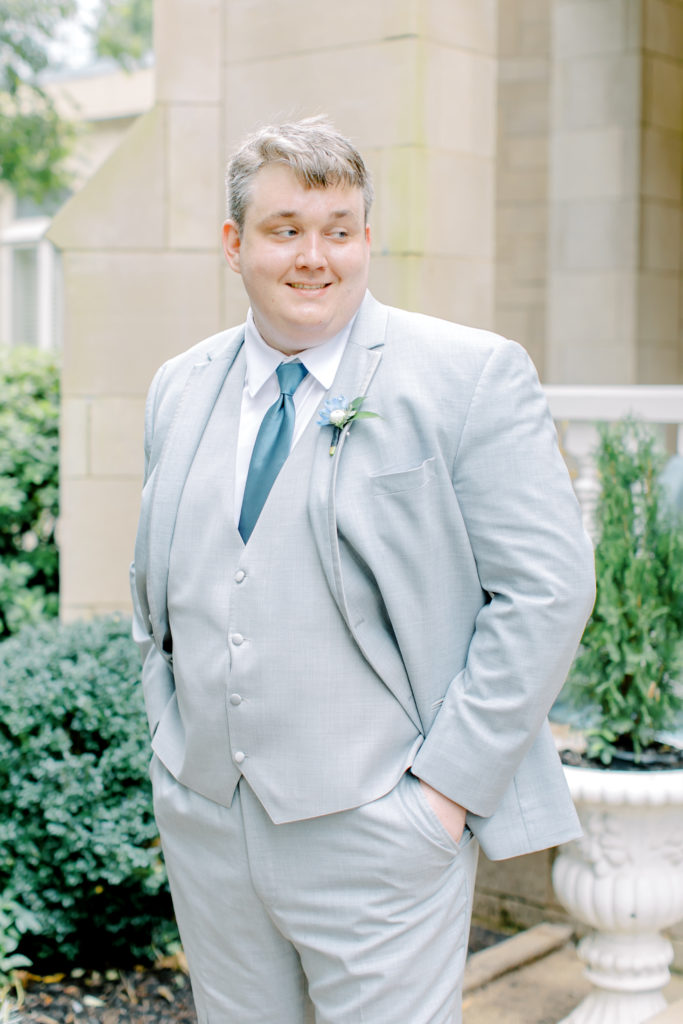 groom in grey tux and blue tie at the wimbish house in atlanta georgia