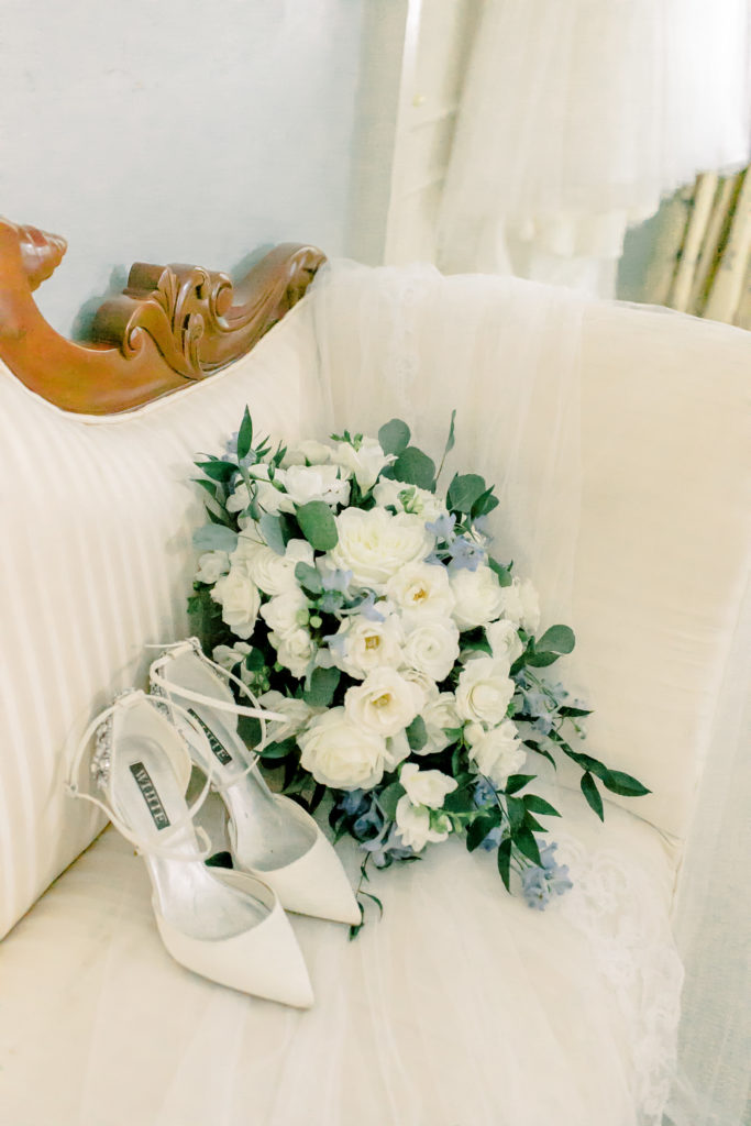 wedding flowers and veil laying on chair at the wimbish house inatlanta