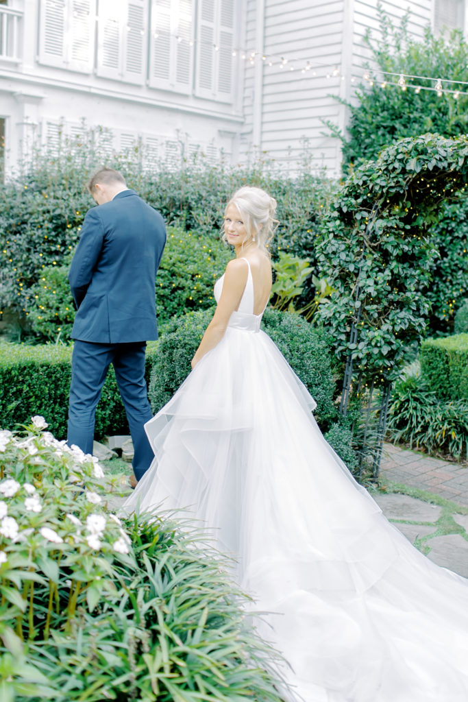 first look with bride and groom in a garden