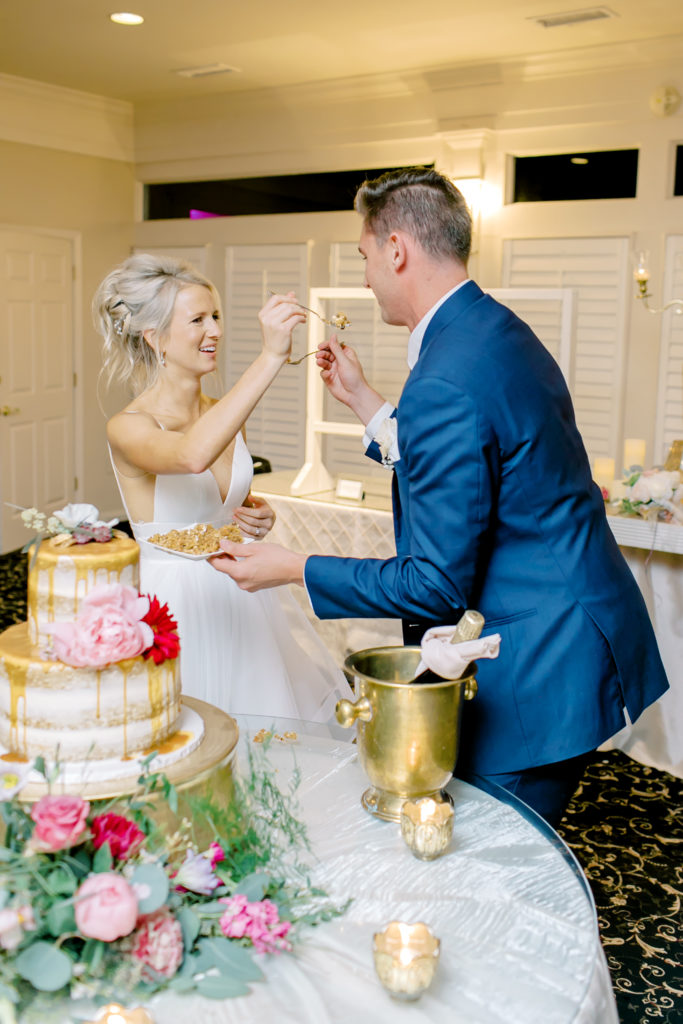 husband and wife feed each other cake
