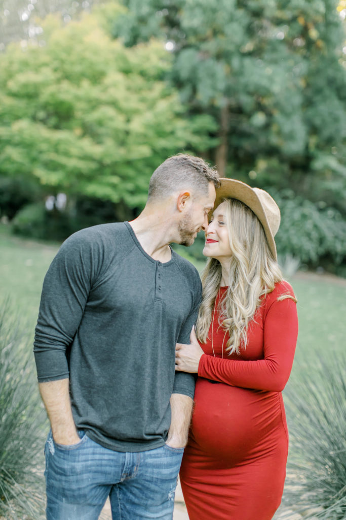maternity session photo with husband and wife hugging