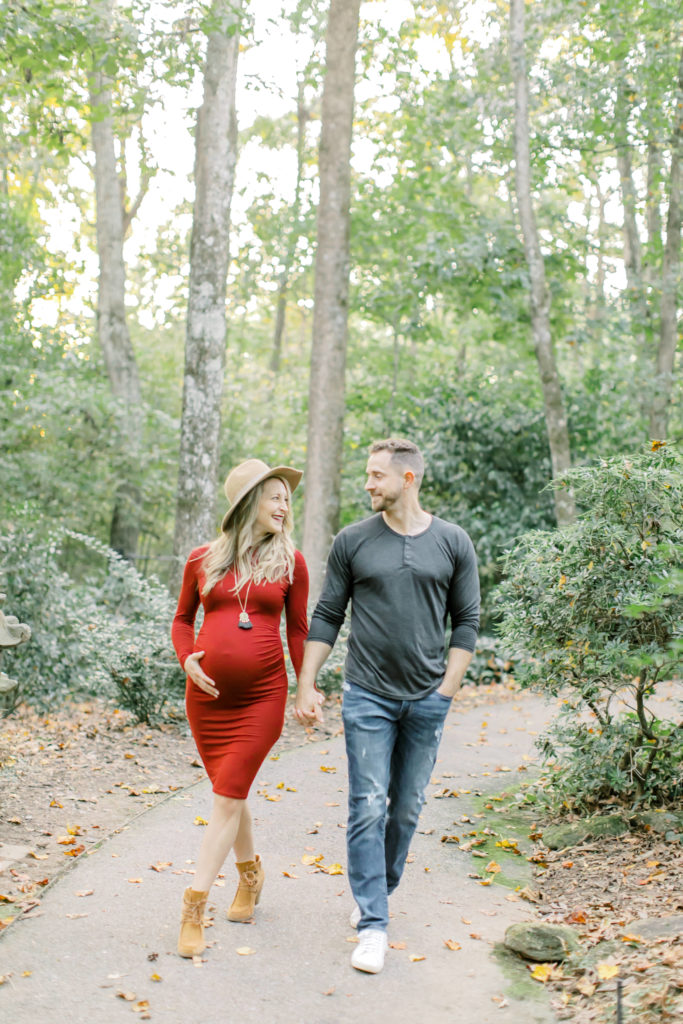 maternity session photo of husband and white walking