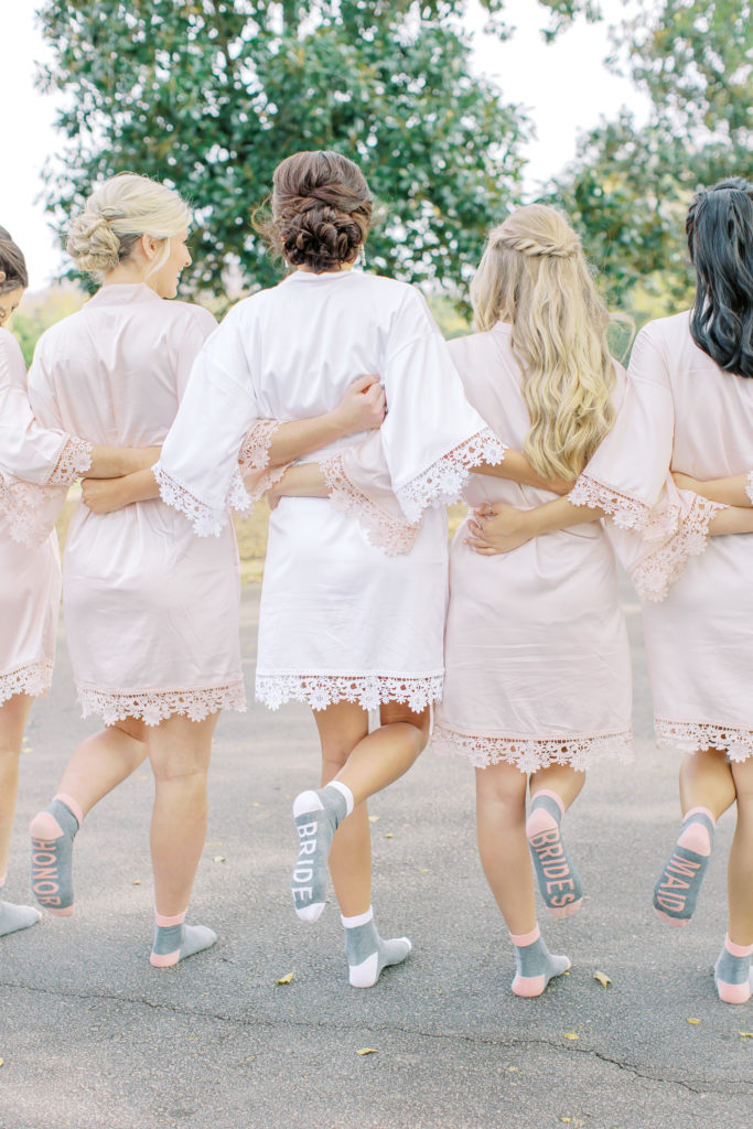 bride and bridesmaids show their fun socks