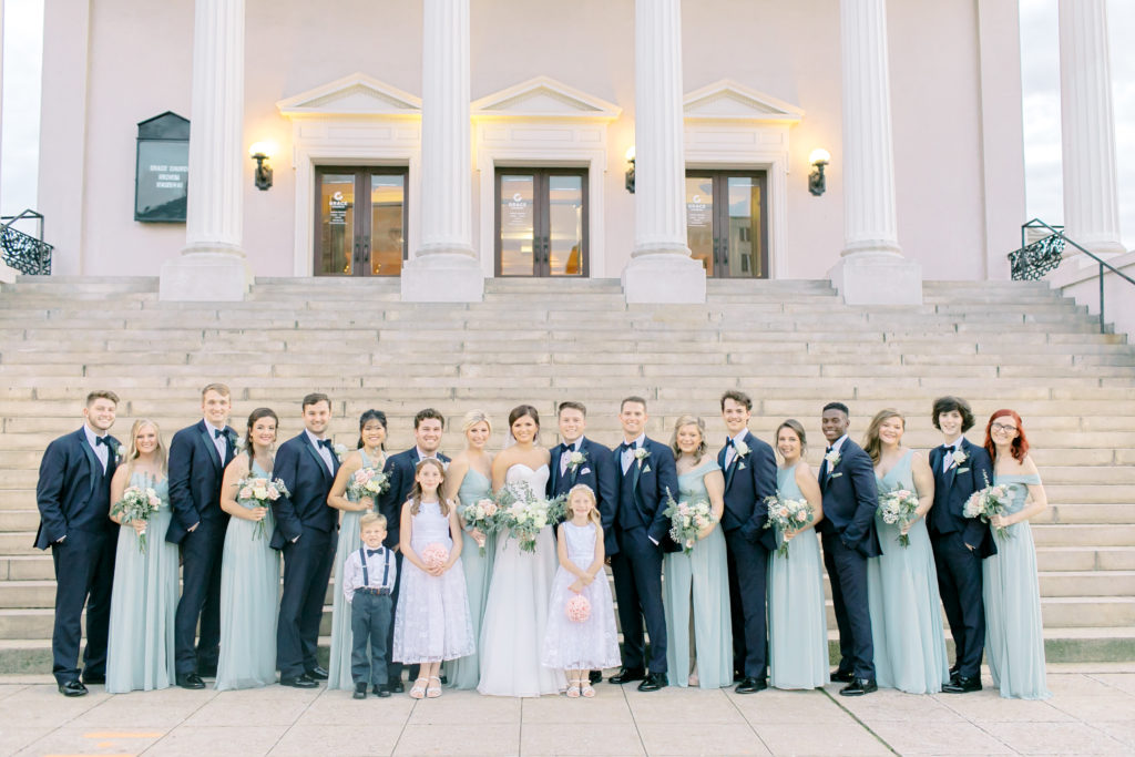 full bridal party outside of grace church in greenville south carolina