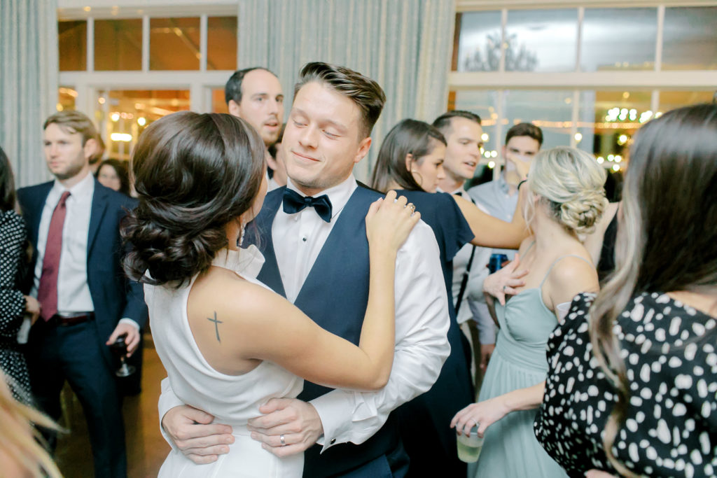 bride and groom share their last first dance