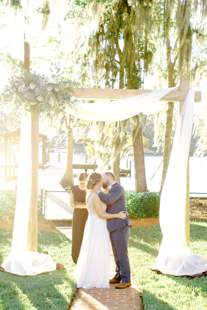 bride and groom first kiss at the altar. jacksonville florida wedding | Photo by Mary Catherine Echols