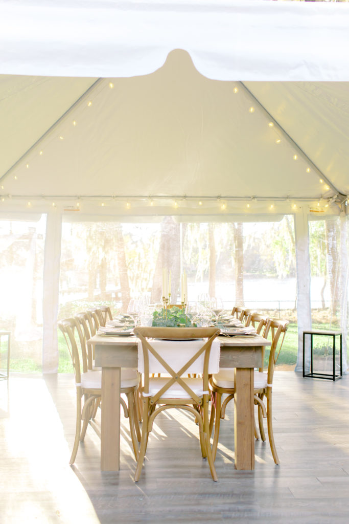 reception space under a tent by the water | micro wedding in jacksonville, florida | Photo by Mary Catherine Echols