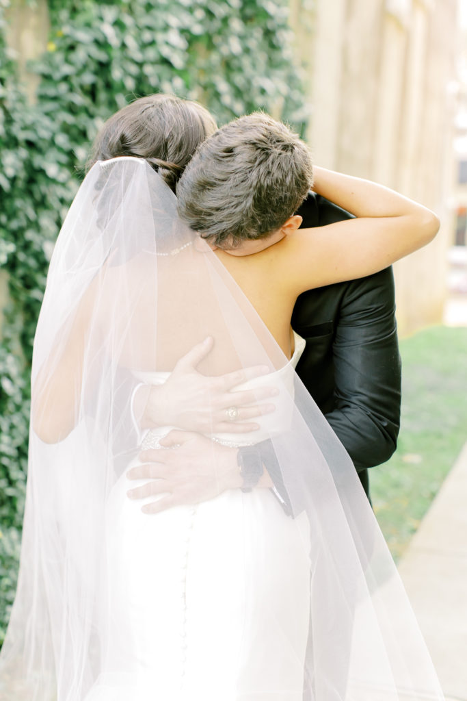 bride and groom hug after their first look | Photo by Mary Catherine Echols