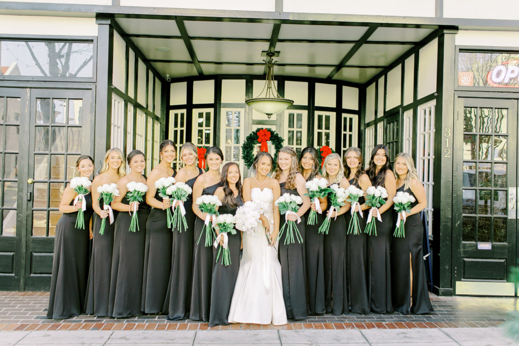 bride with bridesmaids in black dresses | Photo by Mary Catherine Echols 
