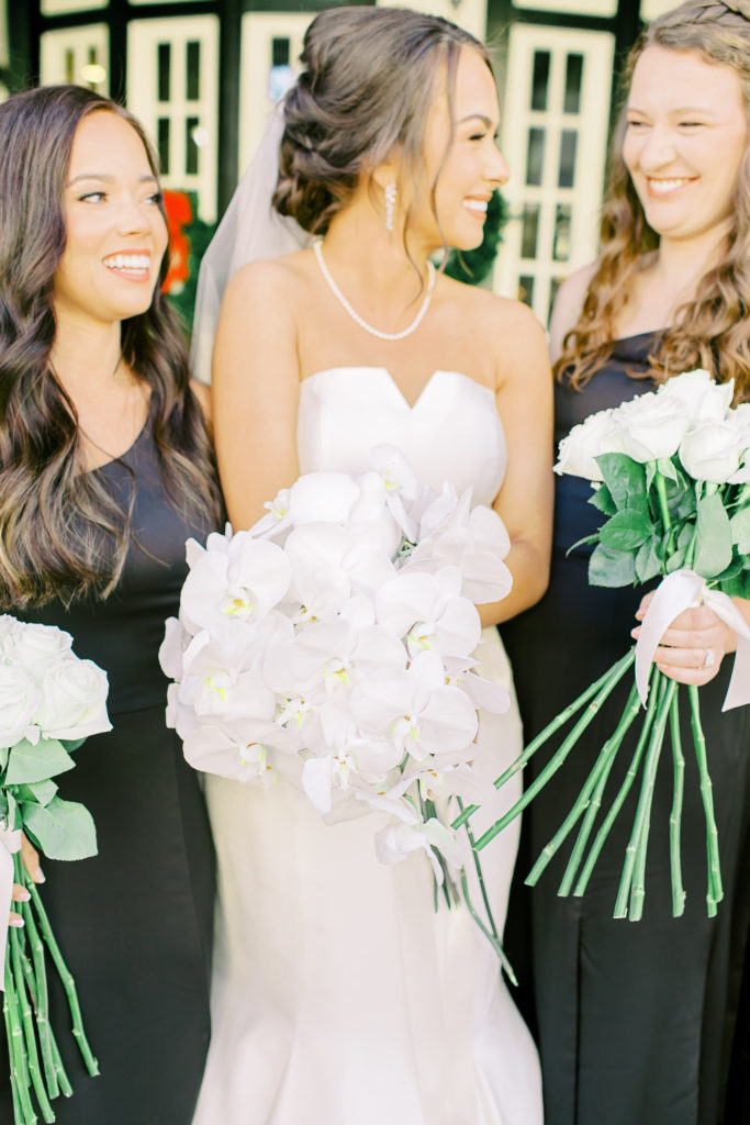 bridesmaids giggle at each other | Photo by Mary Catherine Echols