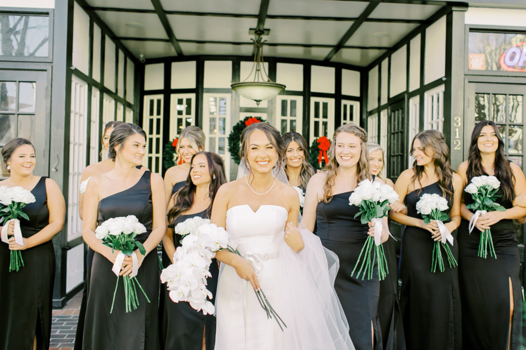 bride walking with her bridesmaids | Photo by Mary Catherine Echols