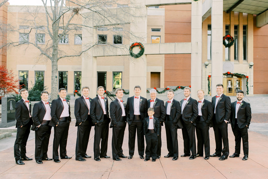 groomsmen line up in downtown anderson at christmas time | Photo by Mary Catherine Echols