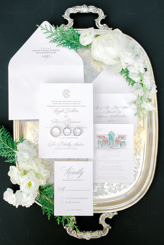 Black and white invitation suite on a silver plater | Photo by Mary Catherine Echols