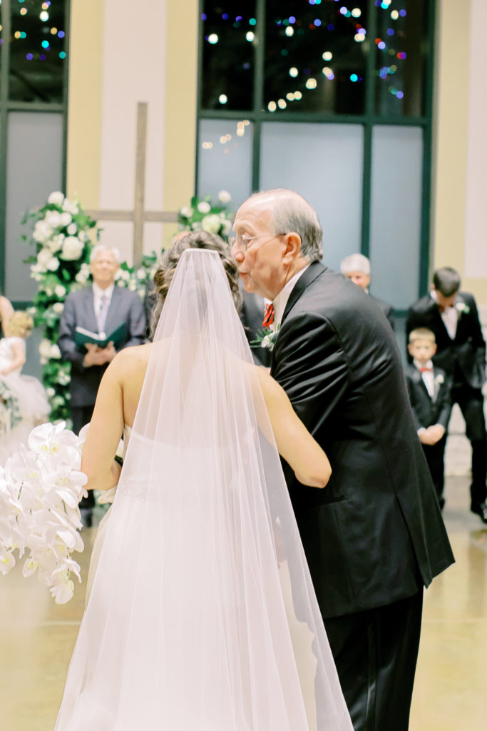 grandfather kisses bride before he gives her away  | photo by mary catherine echols, a jacksonville florida based photographer