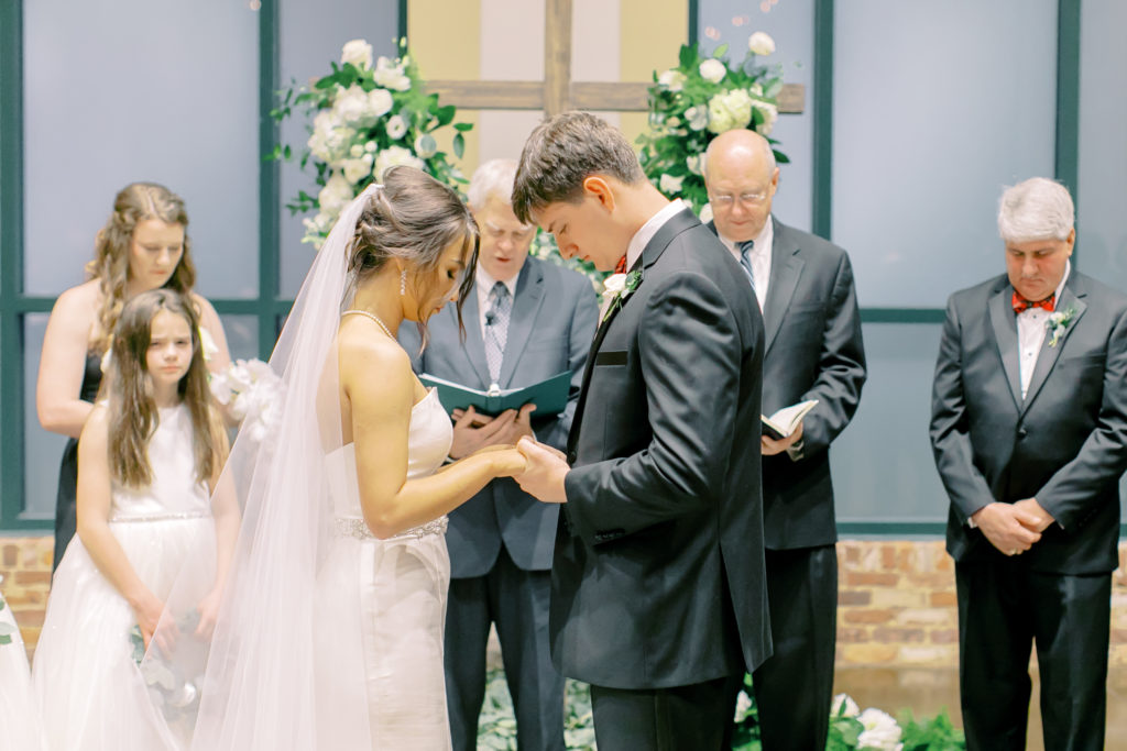 bride and groom pray  | photo by mary catherine echols, a jacksonville florida based photographer