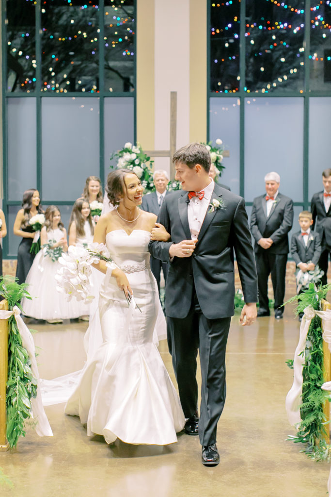 bride and groom smile at each other after ceremony  | photo by mary catherine echols, a jacksonville florida based photographer