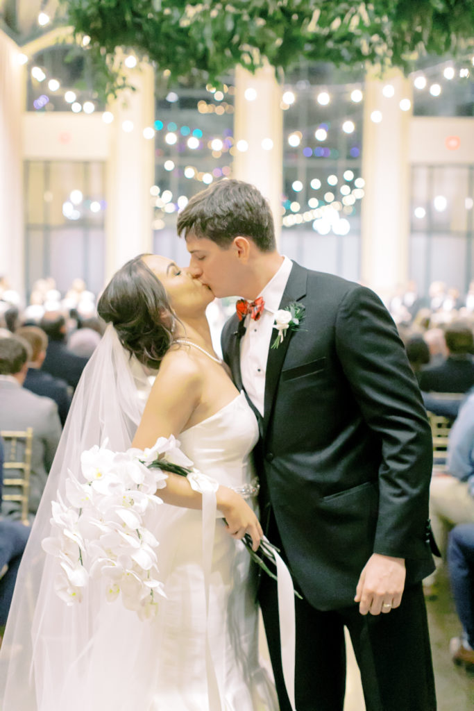 bride and groom kiss and the end of the recessional of ceremony  | photo by mary catherine echols, a jacksonville florida based photographer