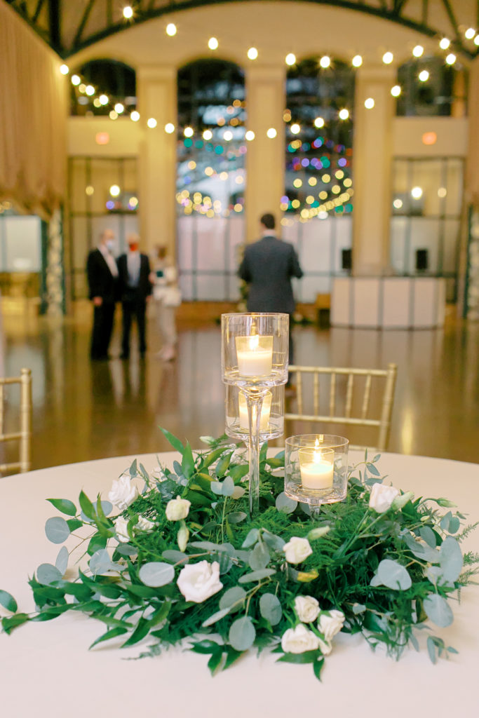 tiered candles on flower centerpiece at reception | photo by mary catherine echols, a jacksonville florida based photographer