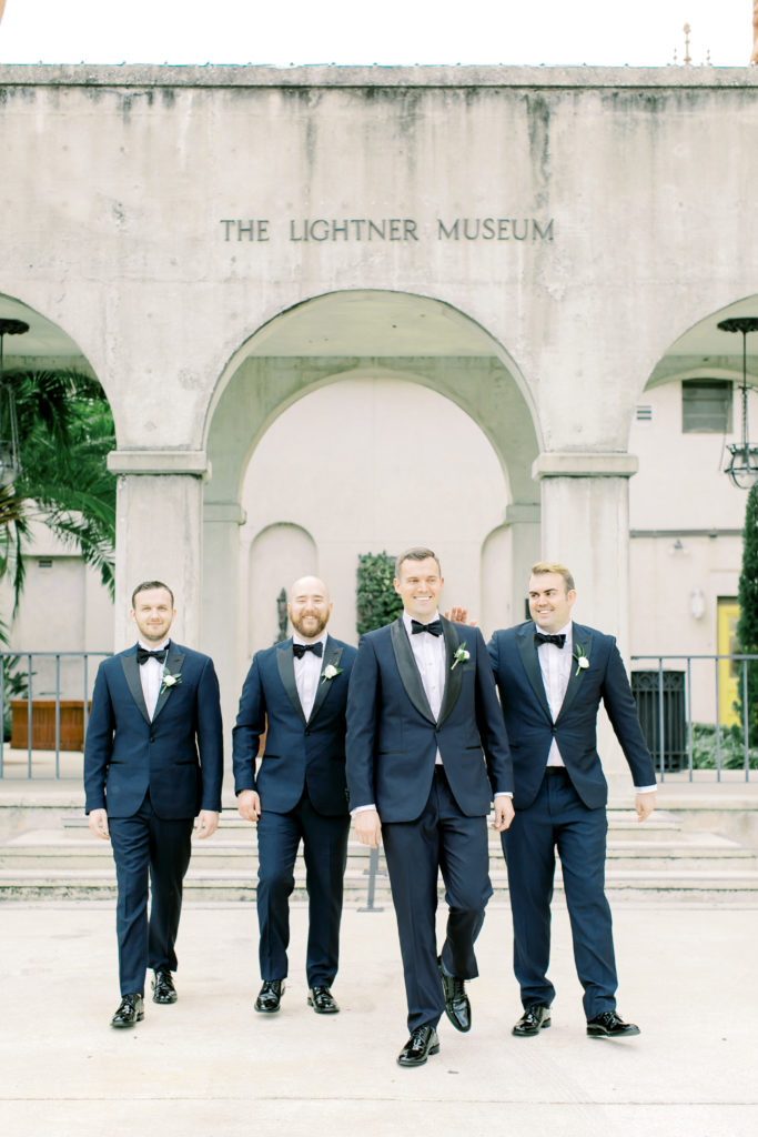 Groomsmen walking together and laughing | Photo by Mary Catherine Echols, a photographer based out of Jacksonville, Florida