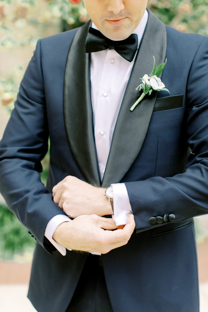 Groom fixing his jacket | Photo by Mary Catherine Echols, a photographer based out of Jacksonville, Florida