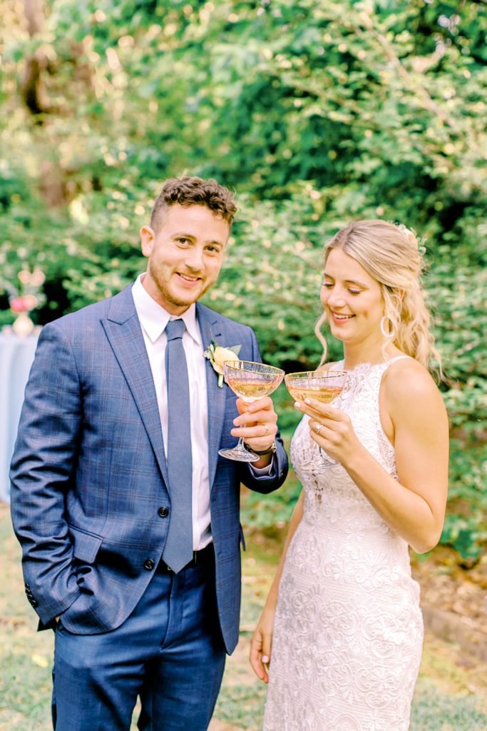 bride and groom cheers at reception| photo by mary catherine echols