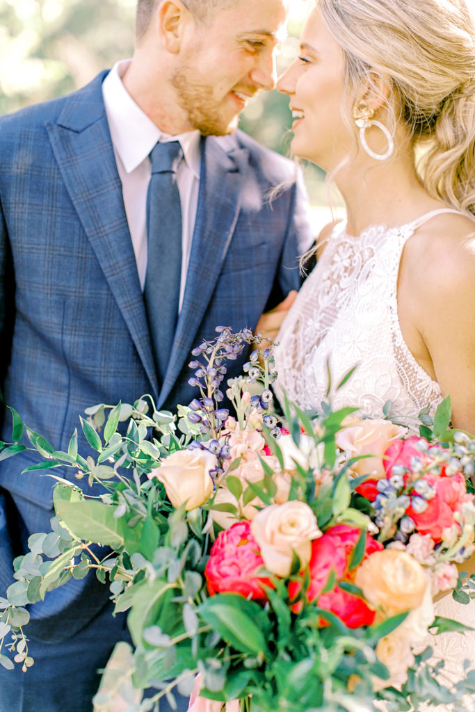 wedding bouquet shot with bride and groom | photo by mary catherine echols