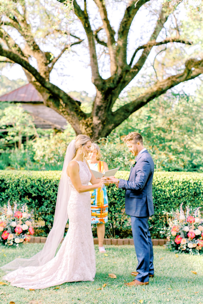 bride and groom exchange vows | photo by mary catherine echols