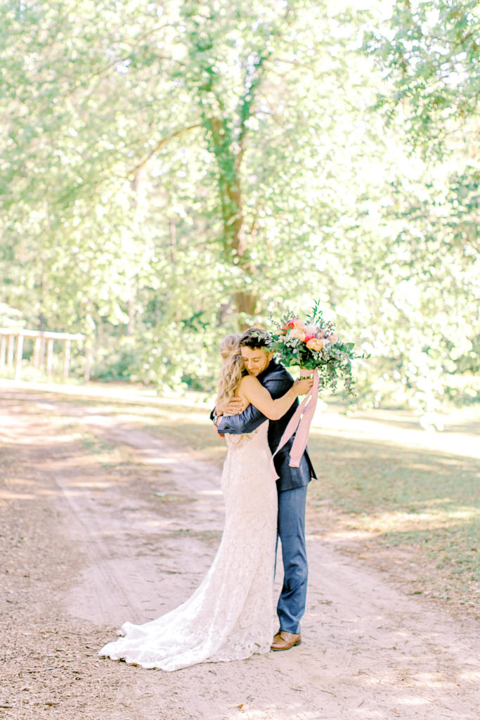 bride and groom hug after their first look | photo by mary catherine echols