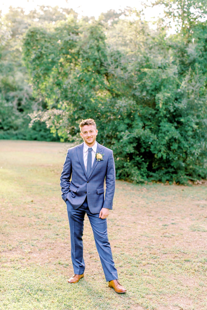 portrait of groom in a field | photo by mary catherine echols