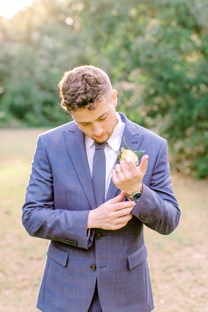 groom fixing his cufflinks | photo by mary catherine echols