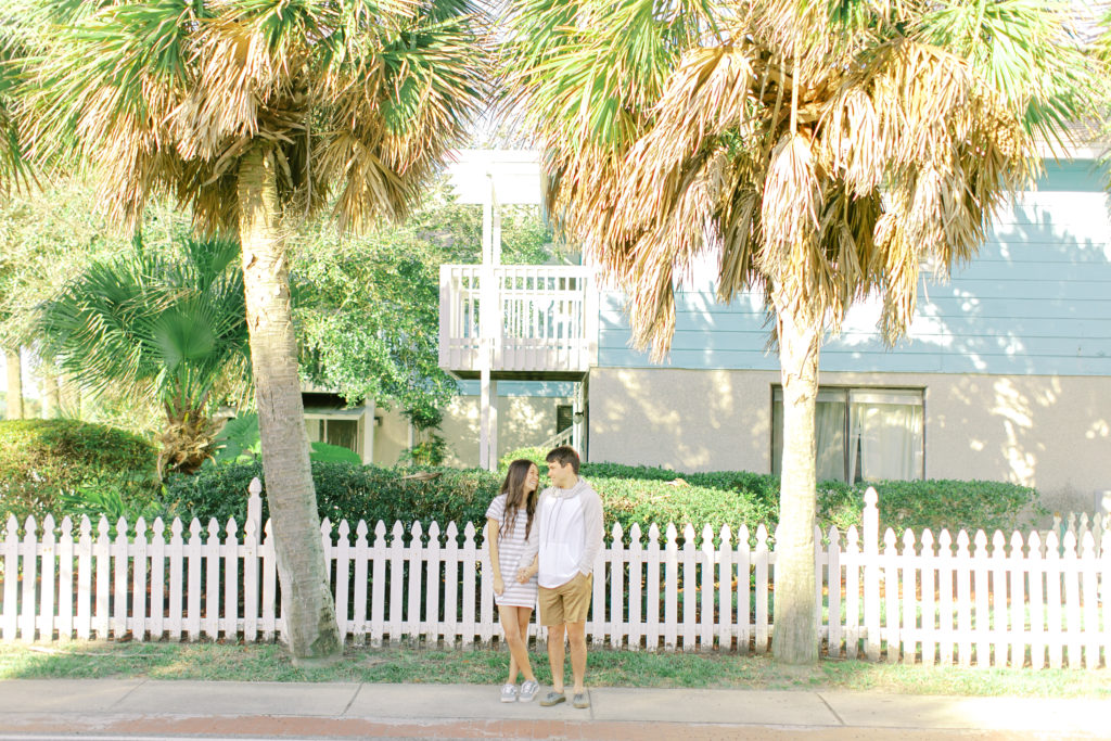 couple between palm trees in atlantic beach florida