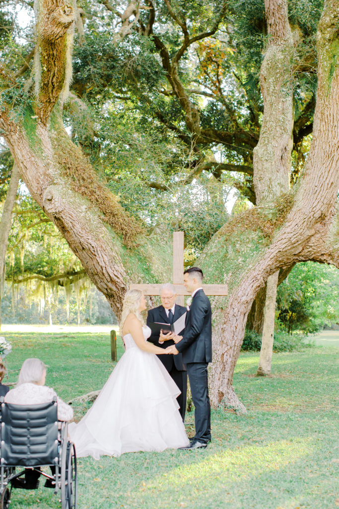 bride and groom exchanging vows at the ribault club in jacksonville | photo by Mary Catherine Echols, a Jacksonville based wedding photographer