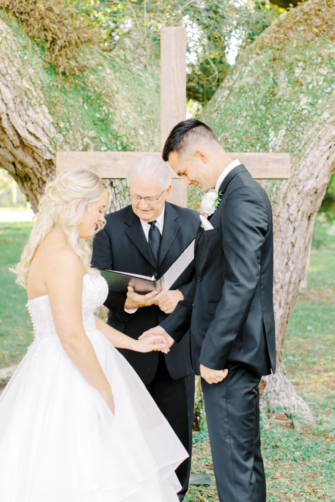 bride and groom praying | photo by Mary Catherine Echols, a Jacksonville based wedding photographer