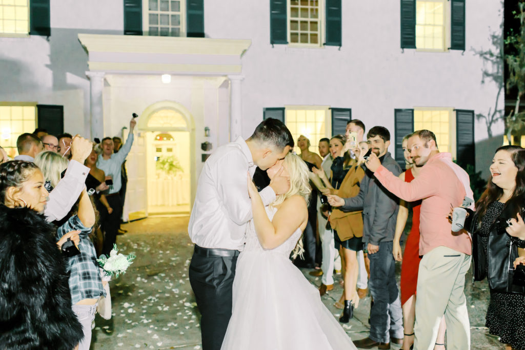 wedding reception send off kiss at the ribault club | photo by Mary Catherine Echols, a Jacksonville based wedding photographer