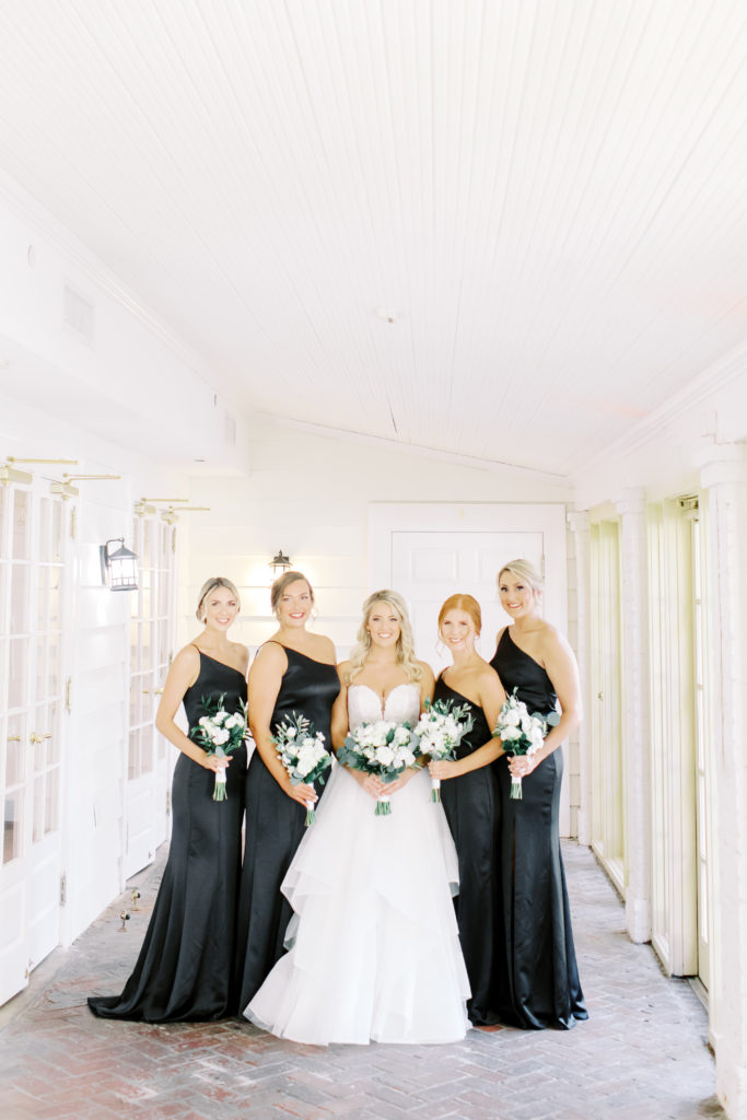bridesmaids in black, a winter wedding at the ribault club | photo by Mary Catherine Echols, a Jacksonville based photographer