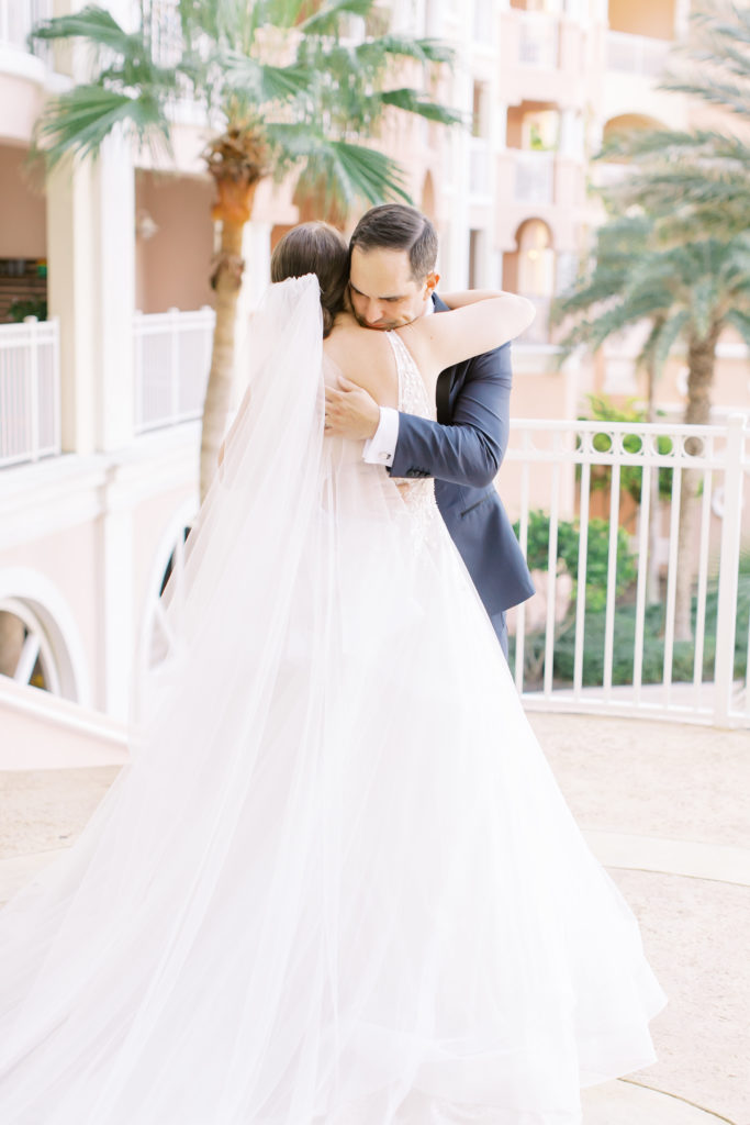 groom hugs bride for the first time