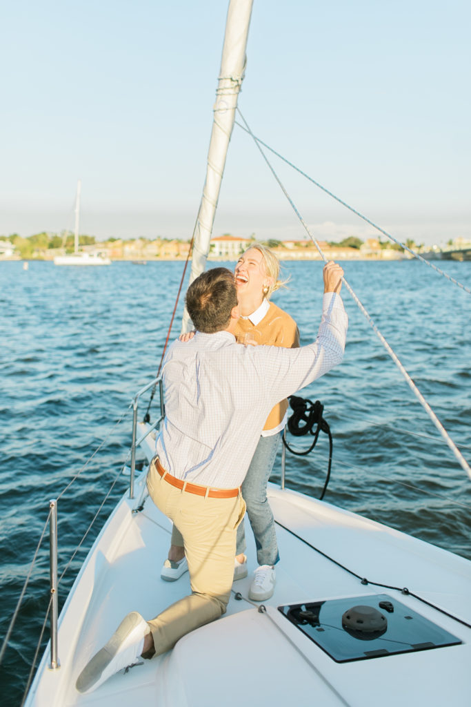 getting down on one knee on a sailboat